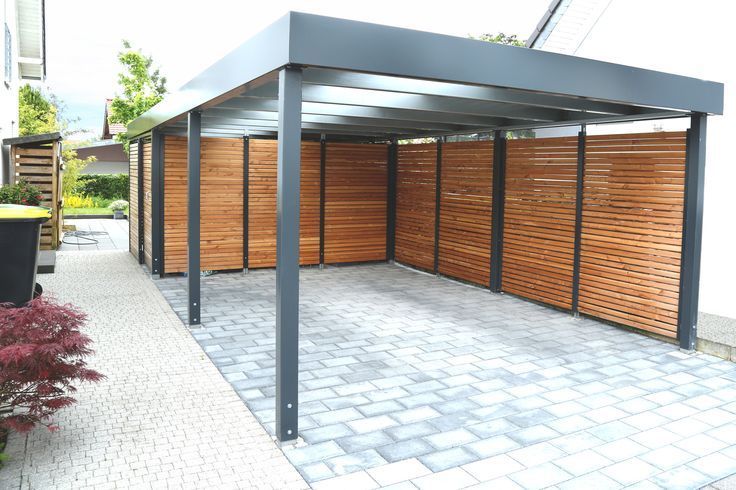 A carport that's been sheltered off from the outdoors with two walls